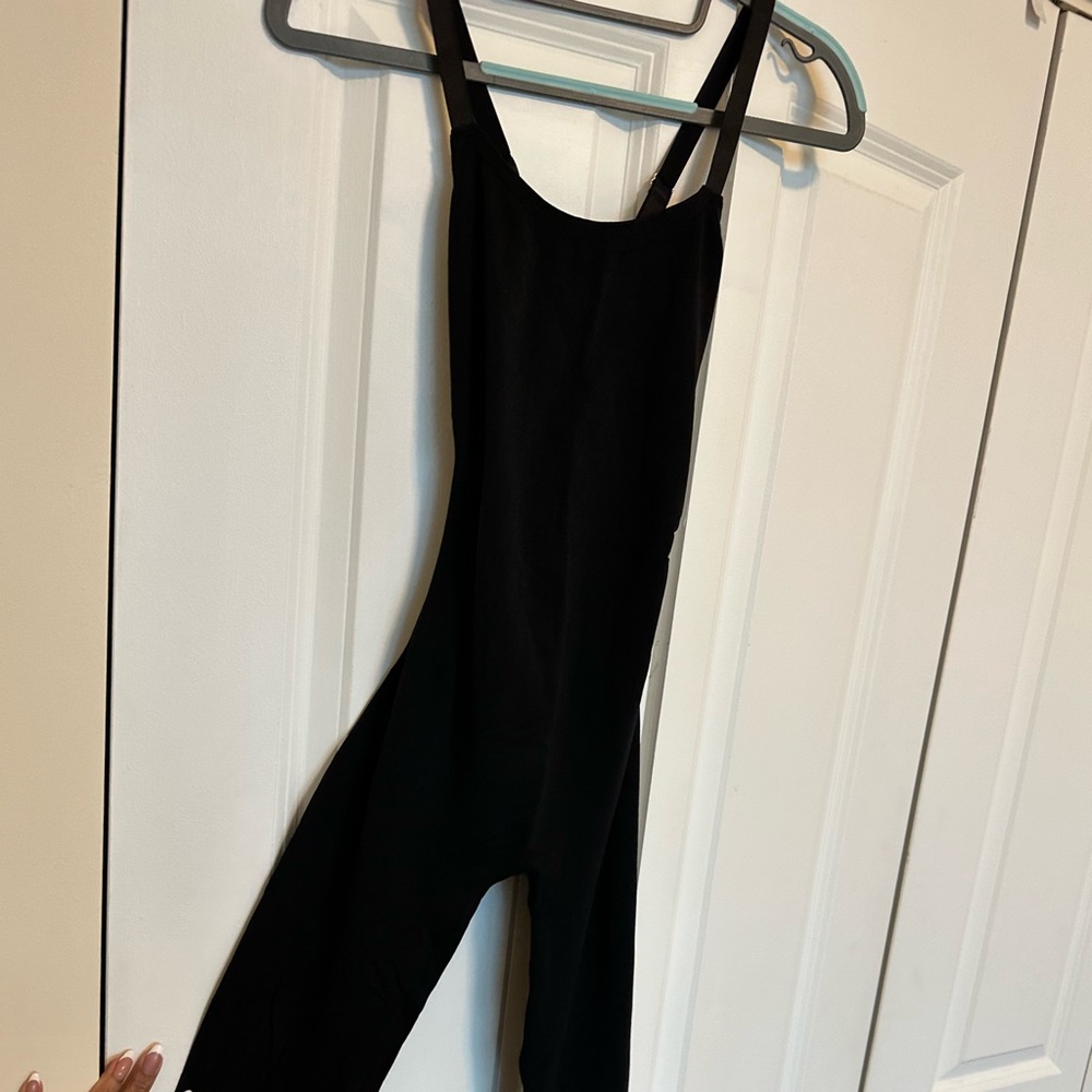 All spandex one piece. One size fits all. Cross straps in the back.
